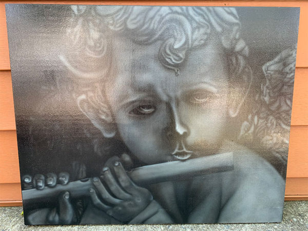 Cherub, child angel playing the flute